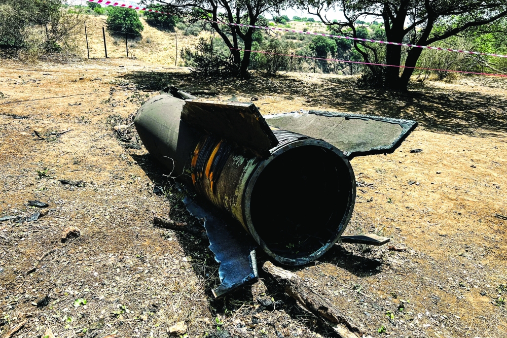 Remains of a ballistic missile lie on the ground following missile attacks, in northern Israel. — Reuters