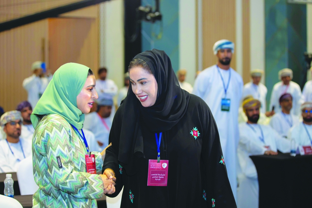 Hajar al Muzaini (L) wins OFA's women seat 