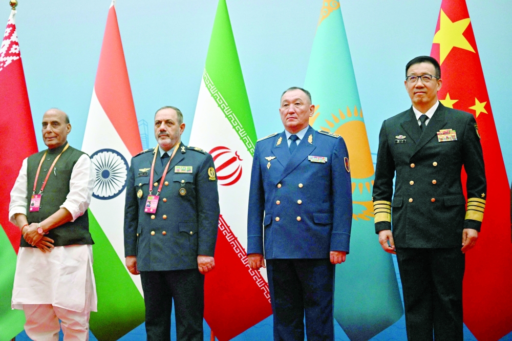 India's Defence Minister Rajnath Singh, Iran's Defence Minister Amir Nasirzadeh, Kazakhstan's Defence Minister Dauren Kossanov and China's Defence Minister Dong Jun during the Defence Ministers' Meeting of the SCO Member States in Qingdao, in eastern China's Shandong province. — AFP