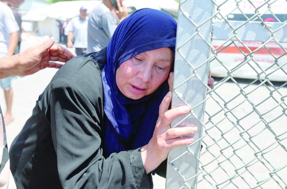 A mourner reacts during the funeral of Palestinians who were killed in an Israeli air strike earlier in the day, in Deir Al Balah, central Gaza Strip. - Reuters