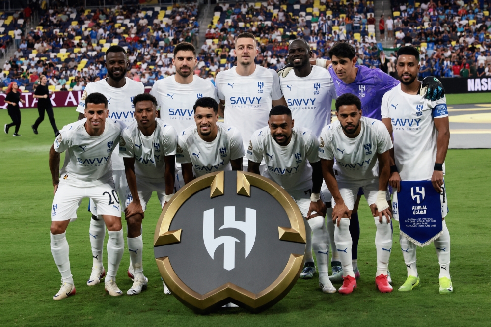 Al Hilal's players pose for group photo before the match. — Reuters
