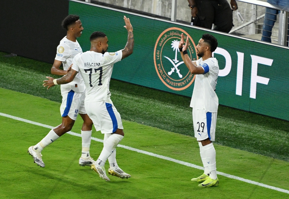 Al Hilal's Salem Al Dawsari celebrates with teammates after first goal. — Reuters