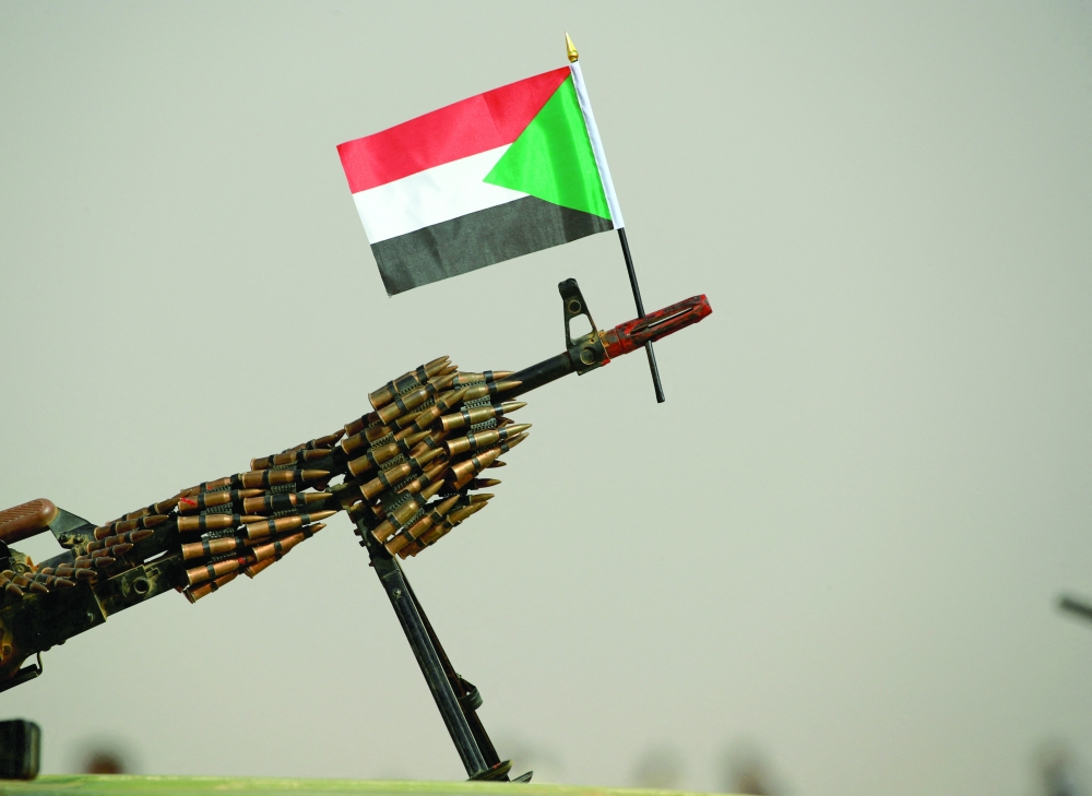 A Sudanese national flag is attached to a machine gun of Paramilitary Rapid Support Forces (RSF) soldiers as they wait for the arrival of Lieutenant General Mohamed Hamdan Dagalo before a meeting