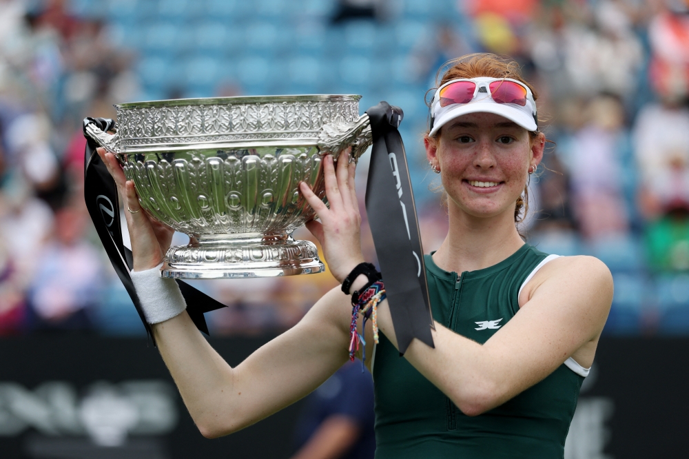Australia's Maya Joint poses with the trophy. — Reuters