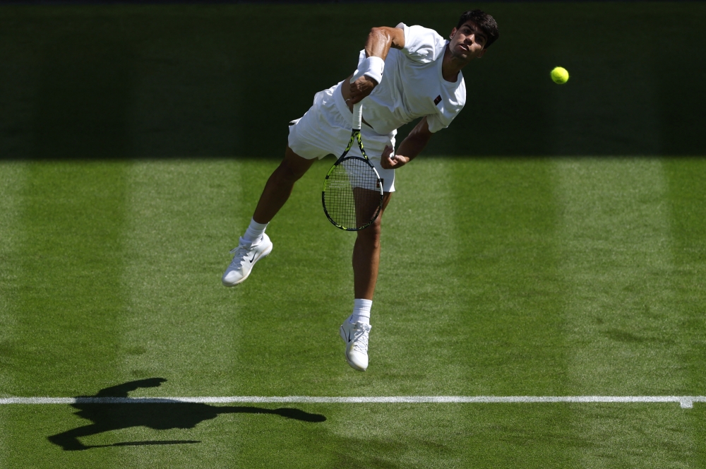 Spain's Carlos Alcaraz in action during his first round match. — Reuters