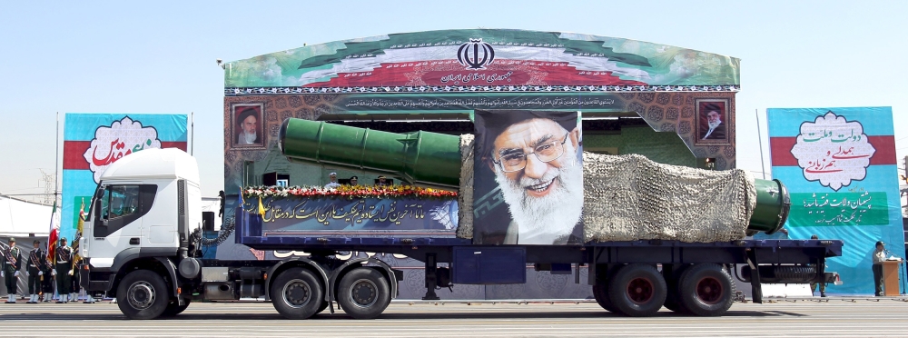 Military truck carrying a missile and a picture of Iran's Supreme Leader Ayatollah Ali Khamenei is seen during a parade marking the anniversary of the Iran-Iraq war (1980-88), in Tehran