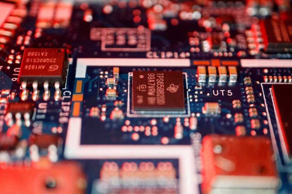 Semiconductor chips are seen on a circuit board of a computer. — Reuters