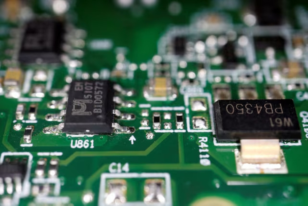 Semiconductor chips are seen on a printed circuit board in this illustration picture. — Reuters