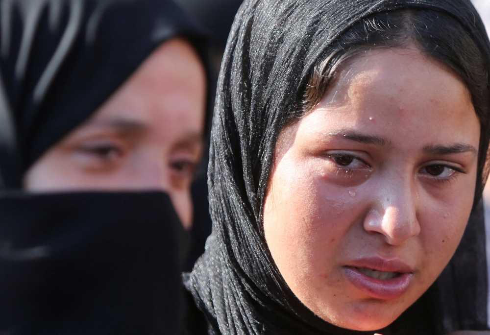 A mourner reacts during the funeral of Palestinians at Nasser Hospital in Khan Younis, southern Gaza Strip. - Reuters 
