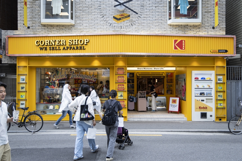 Ser Wei Kam, rear left, and her friends shopping at Corner Shop, a Kodak Apparel store in Seoul, May 29, 2025. (Woohae Cho/The New York Times)