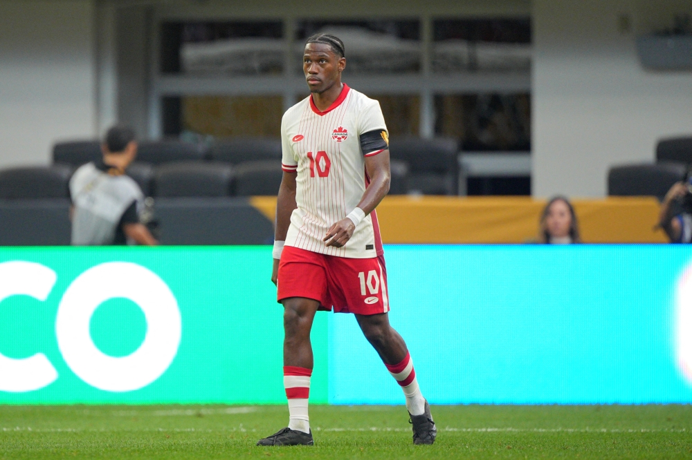 Jun 29, 2025; Minneapolis, Minnesota, USA; Canada forward Jonathan David (10) reacts after scoring a goal against Guatemala in the first half during a quarterfinal match of the 2025 Gold Cup at U.S. Bank Stadium. Mandatory Credit: Brad Rempel-Imagn Images