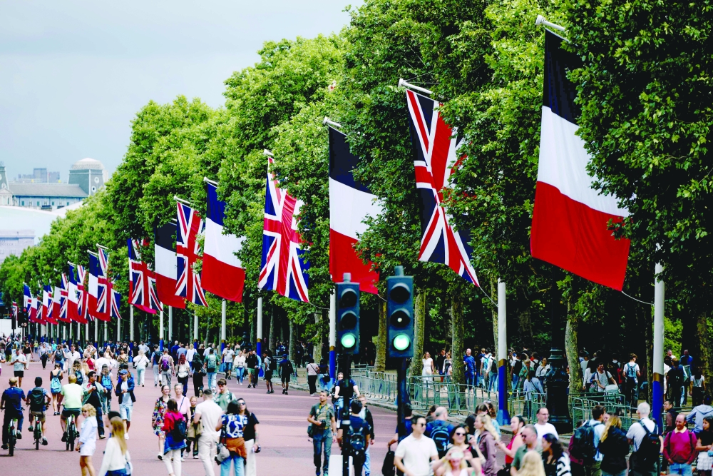 Union Jack and French flags are are displayed down The Mall in London. — AFP