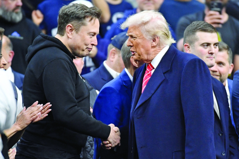 Elon Musk, President Donald Trump appear during the Division I Men's Wrestling Championship. — Reuters file photo