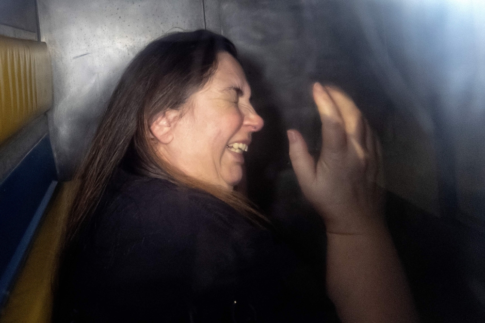 Erin Patterson is arriving in the back of a prison transport vehicle 