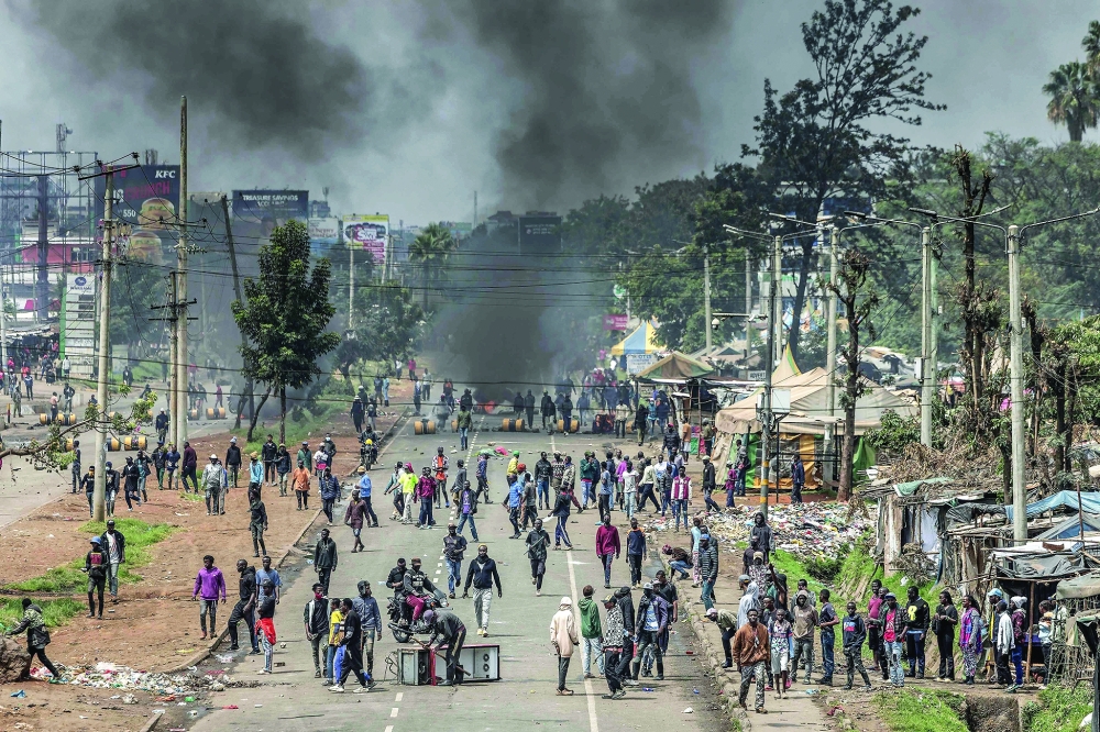 Protesters gather to block a main road