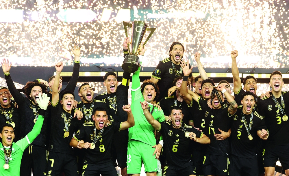Mexico players celebrate after the match. — Reuters
