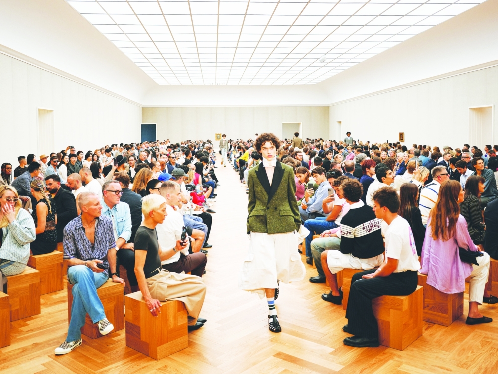Jonathan Andersons take on the Bar jacket, Diors most famous womens wear shape, is paired with cargo shorts at the Dior spring 2026 fashion show in Milan in June 2025. (Simbarashe Cha/The New York Times)