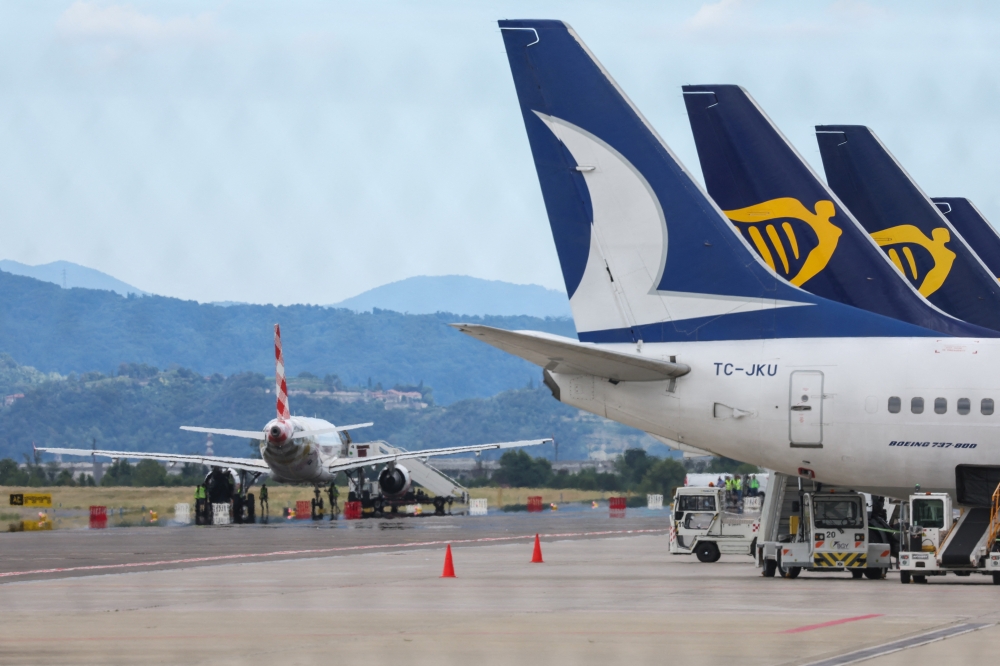 Aircraft are seen at Milan Bergamo Airport, after flight operations were temporarily suspended when a person died on a runway during take-off preparations, in Orio al Serio, near Bergamo, Italy, July 8, 2025. REUTERS/Claudia Greco
