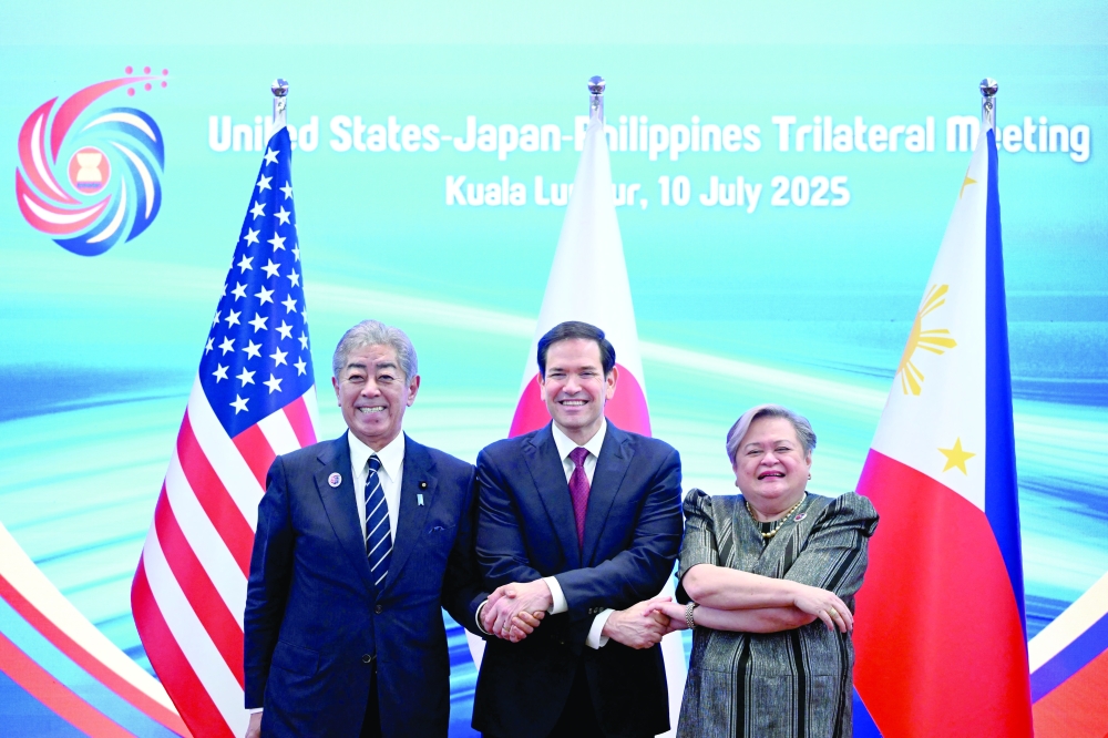 US Secretary of State Marco Rubio poses with Japan's Foreign Minister Takeshi Iwaya and Philippines' Foreign Secretary Theresa Lazaro at a trilateral meeting during the 58th Asean Foreign ministers meeting and related meetings in Kuala Lumpur. — Reuters