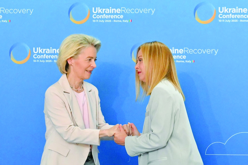 Italy's Prime Minister Giorgia Meloni (R) welcomes van European Commission President Ursula Von der Leyen ahead of the start of The Ukraine Recovery Conference 2025 (URC2025) at The Roma Convention Centre in Rome on July 10, 2025.