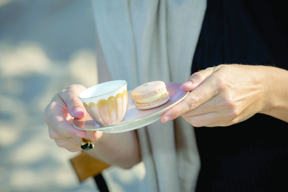 A small porcelain cup placed on a plate echoing the Arabian tradition of hospitality.