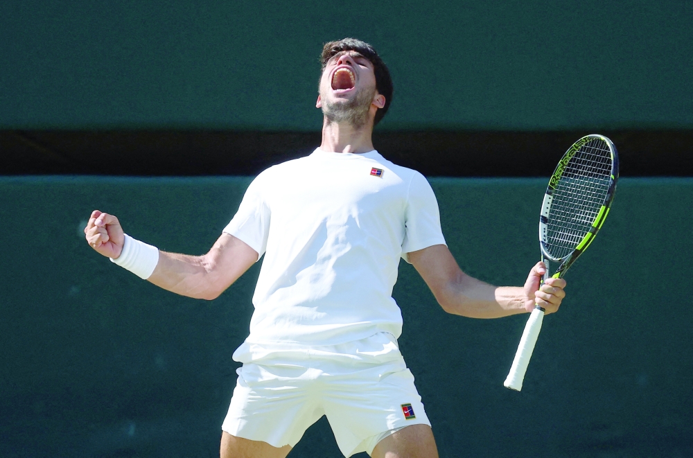 Spain's Carlos Alcaraz celebrates after winning his semifinal match. — Reuters