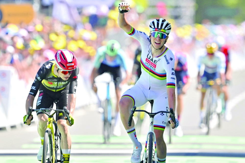 XRG team's Slovenian rider Tadej Pogacar cycles to the finish line. — AFP
