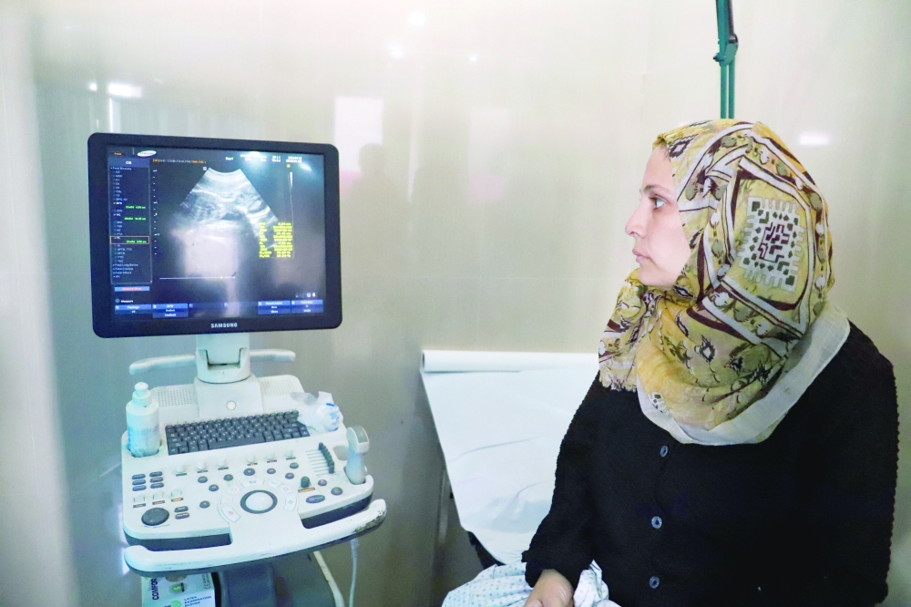 Fatima Arafa, a pregnant and displaced Palestinian woman, has a consultation with a doctor, at Al Helou Hospital, in Gaza City. - Reuters
