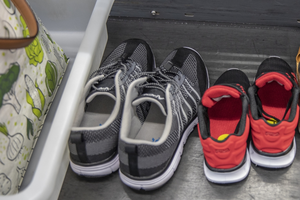 Shoes at a TSA checkpoint at John F. Kennedy International Airport in New York, Aug. 19, 2021. (Tony Cenicola/The New York Times)