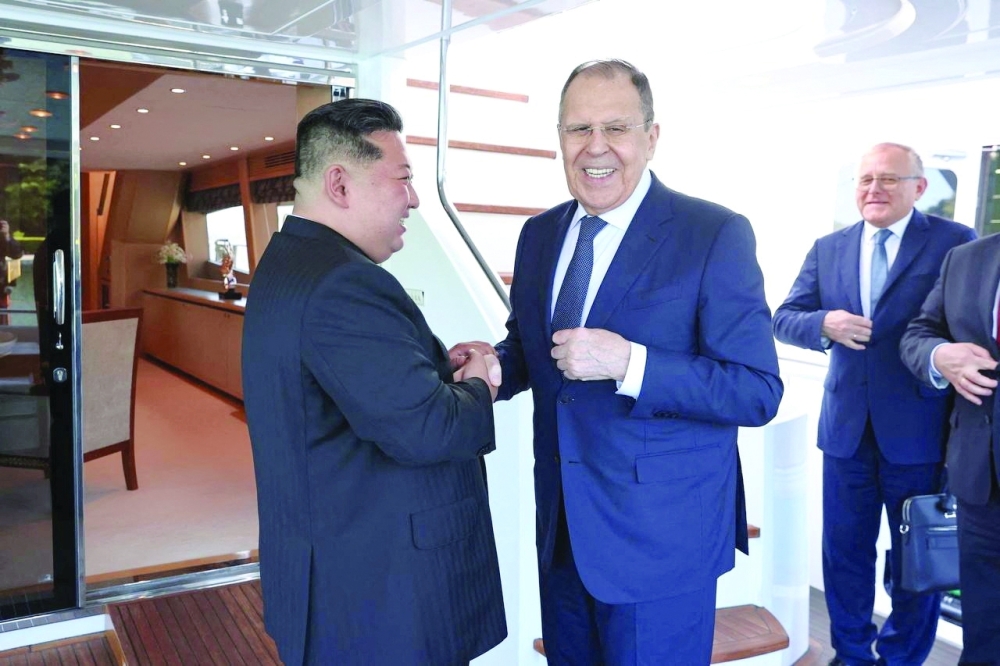 North Korean leader Kim Jong Un shakes hands with Russian FM Sergei Lavrov during a meeting in Wonsan. — Reuters 