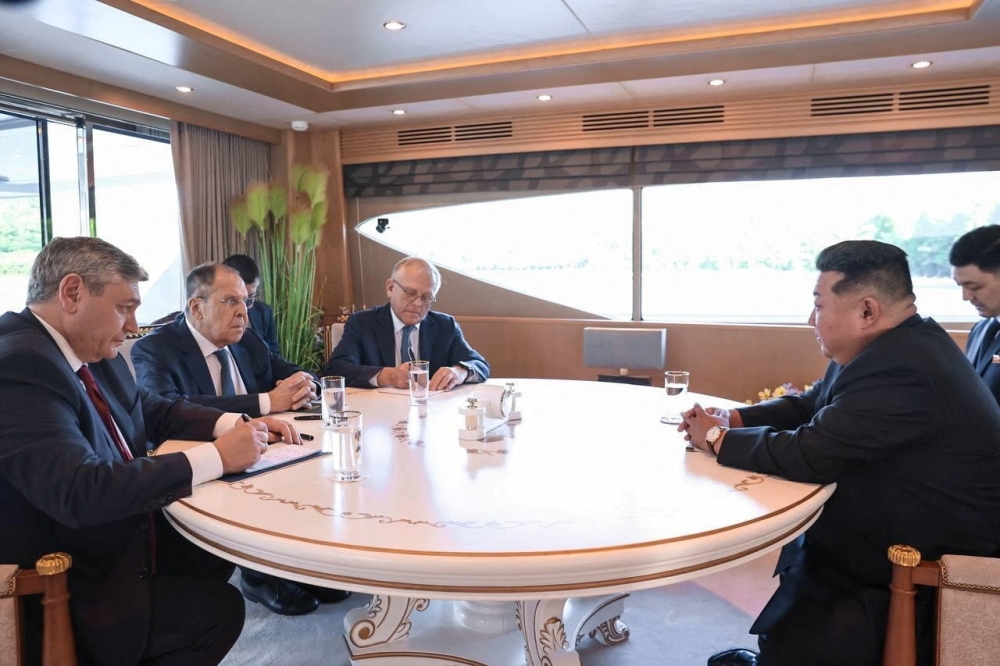 Kim Jong Un and Sergei Lavrov attend a meeting in Wonsan. — Reuters 