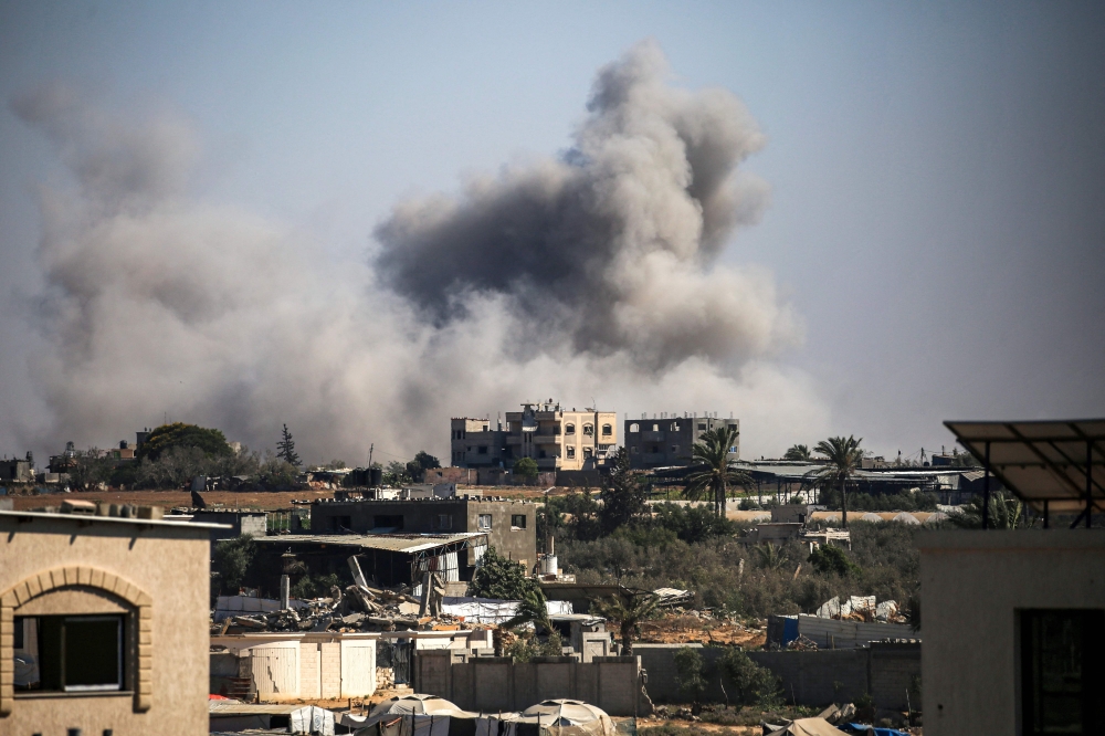 Smoke plumes rise from Israeli bombardment in Bureij in the central Gaza Strip. — AFP