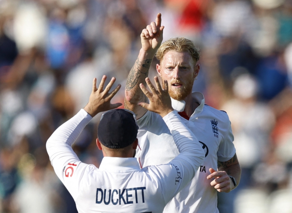 Ben Stokes celebrates with Ben Duckett  after taking the wicket of Akash Deep at Lord's on Sunday