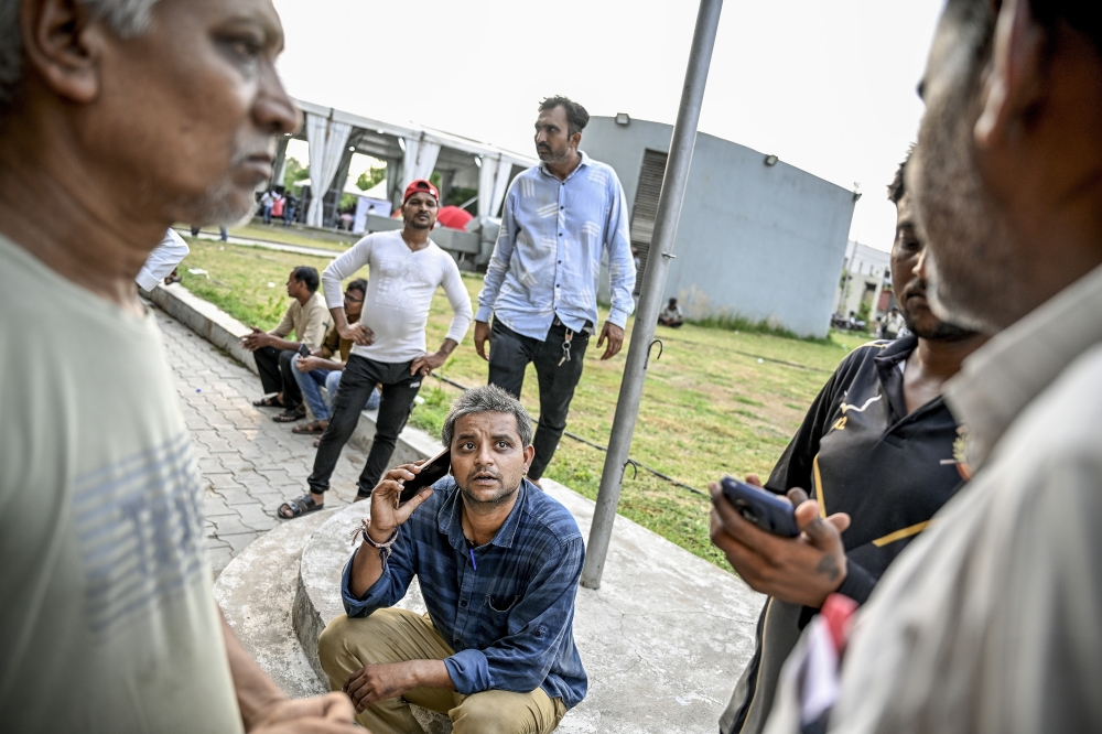 Ravi Thakur, 32, who has been seeking word about his mother and daughter, at Ahmedabad Civil Hospital in Ahmedabad, India, June 15, 2025. (Atul Loke/The New York Times)