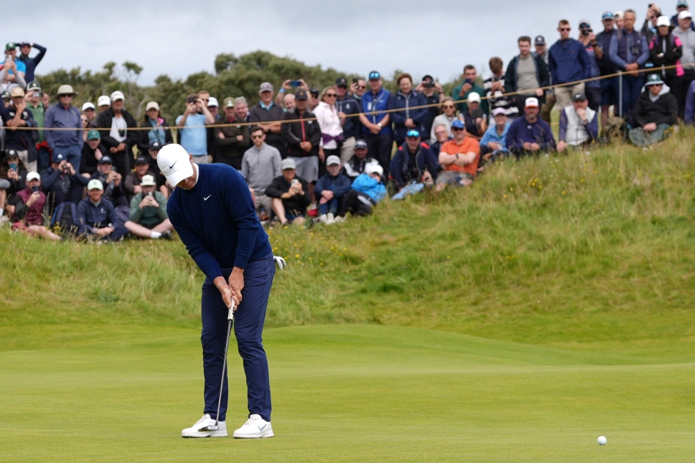 Northern Ireland's Rory McIlroy putts on the 7th green during the second round. — Reuters
