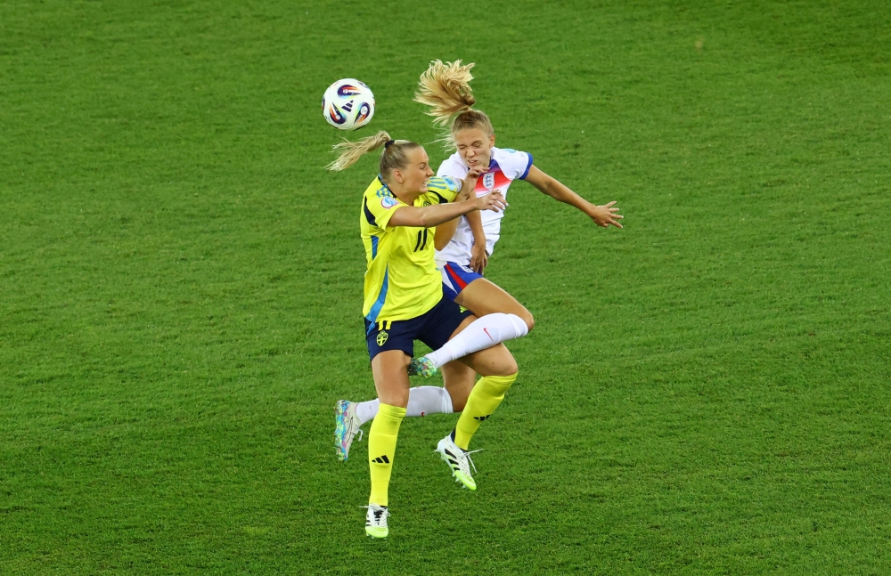  England's Esme Morgan in action with Sweden's Stina Blackstenius. — Reuters