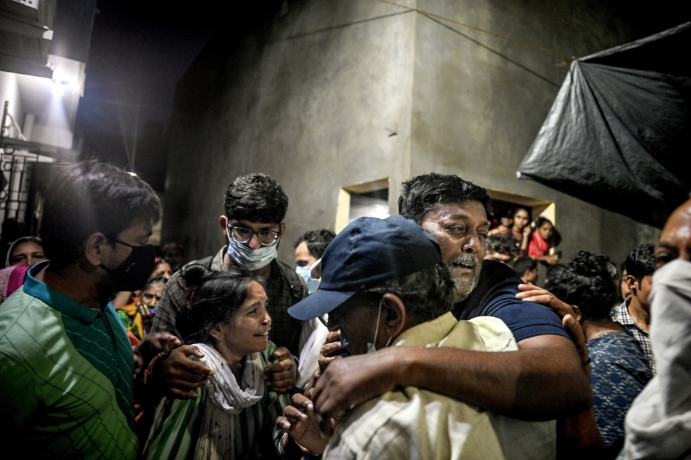 Anil Ambalal Patel’s relatives console him after he learned he would receive the remains of his son and daughter-in-law in Ahmedabad, India, June 17, 2025. (Atul Loke/The New York Times)
