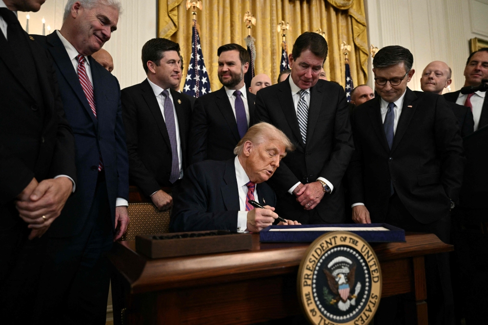 US President Donald Trump signs the GENIUS Act 