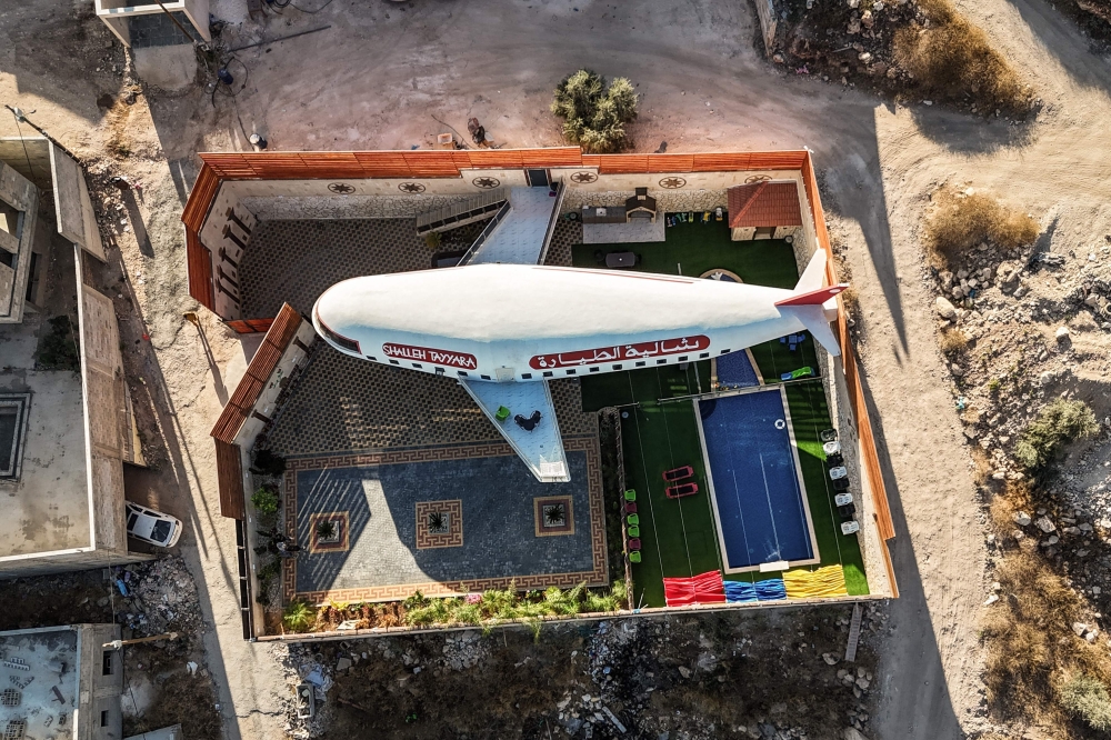 A guest house built in the shape of an airplane in Qaffin. — AFP