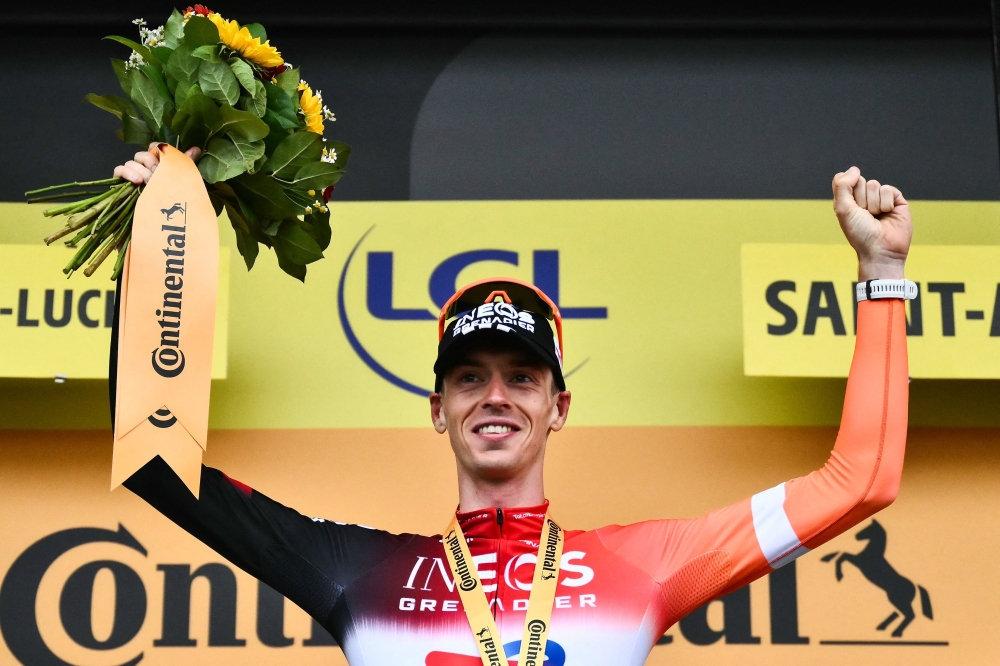 Dutch rider Thymen Arensman celebrates on the podium. — AFP