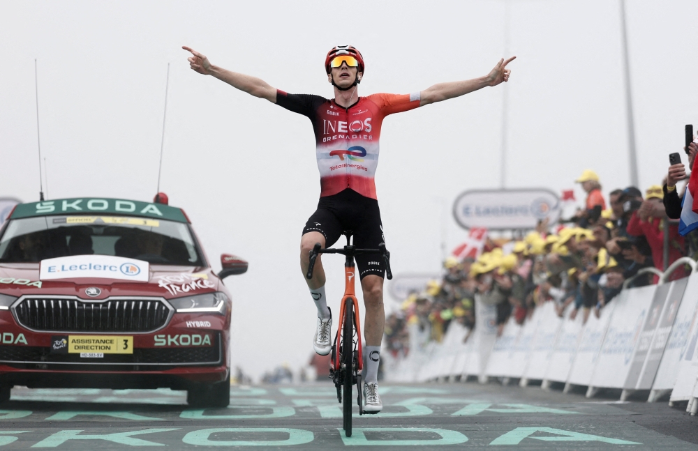 Dutch rider Thymen Arensman cycles to the finish line to win the 14th stage. — Reuters