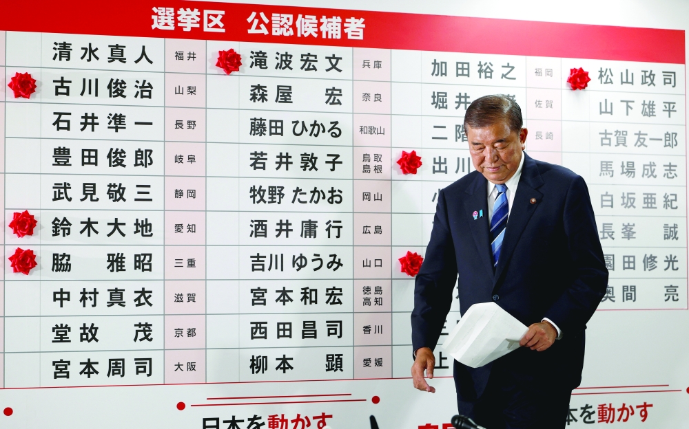 Shigeru Ishiba, Japan's Prime Minister and president of the ruling Liberal Democratic Party (LDP), walks in front of a board with showing elected candidates at the LDP headquarters, in Tokyo. — Reuters