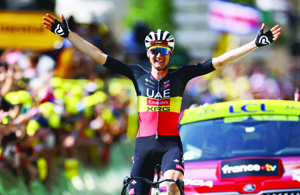 UAE Team Emirates XRG’s Tim Wellens celebrates as he crosses the finish line to win stage 15 on Sunday. — Reuters
