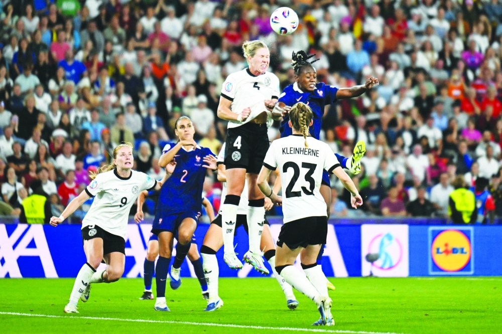 Germany’s defender #04 Rebecca Knaak (Top-L) and France’s forward #09 Melvine Malard (Top-R) jump to head the ball during the UEFA Women’s Euro 2025 quarter finals football match. — AFP