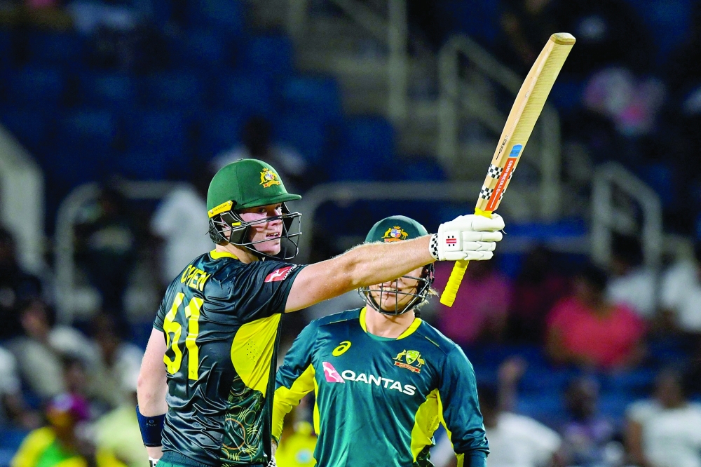 Mitchell Owen (L) of Australia celebrates his half century during the 1st T20i between West Indies and Australia at Sabina Park, Kingston, Jamaica. — AFP