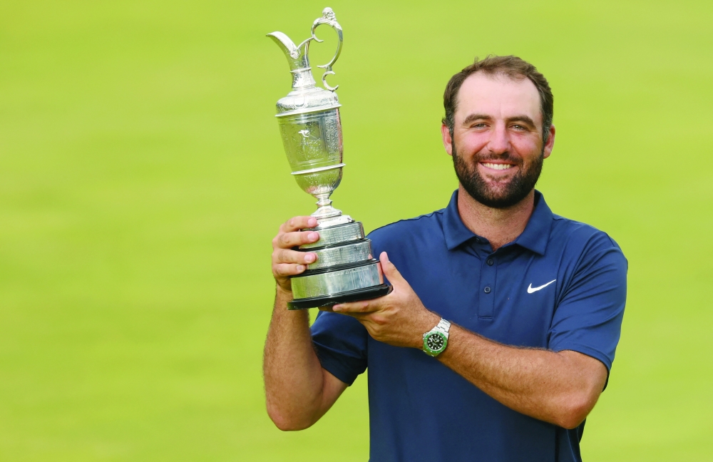 Scottie Scheffler celebrates with the Claret Jug after winning the 153rd Open Championship golf tournament at Royal Portrush. — Reuters
