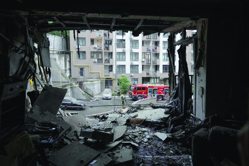 This photo shows a damaged residential building following a Russian attack in Kyiv. — AFP