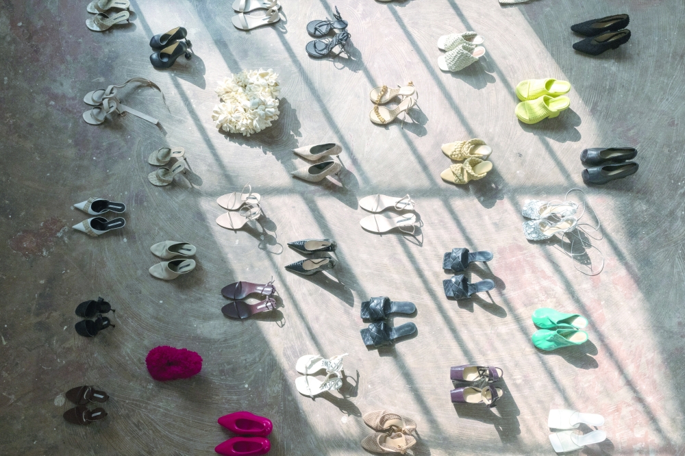 Dozens of Nina Christen’s shoe designs — Bottega Veneta, Loewe and Celine, among them — arranged in a grid in her home studio in Paris, June 26, 2025. (Dmitry Kostyukov/The New York Times)