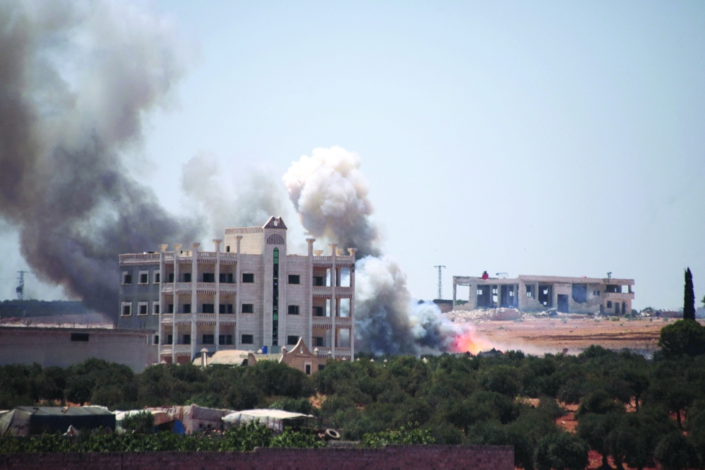 A plume of smoke rises following an explosion in Maarat Misrin in the northern part of Syria's Idlib. - AFP