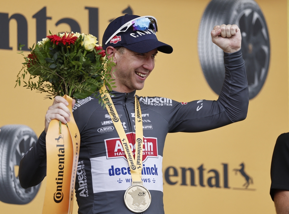
Kaden Groves celebrates on the podium after winning stage 20. — Reuters 